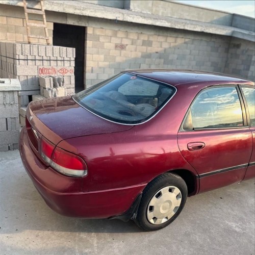 Mazda 626 1996 sağ arka çamurluk kırmızı