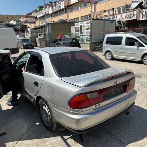 Mazda 323 1.5 1998 sol arka stop camı